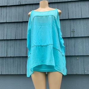 Jennifer Lopez Ocean blue blouse.